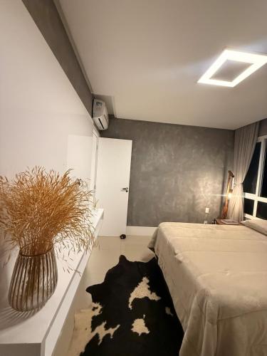 Ένα ή περισσότερα κρεβάτια σε δωμάτιο στο Cobertura dúplex frente mar
