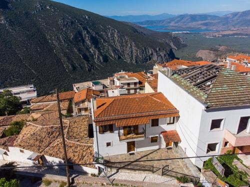 a view of a village with mountains in the background at Delphi View - 3 Bedrooms apartment, fully equipped in Delphi
