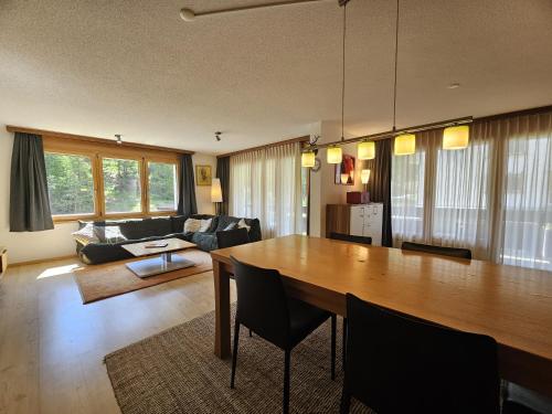 a living room with a table and a couch at Mischi 5 in Saas-Fee