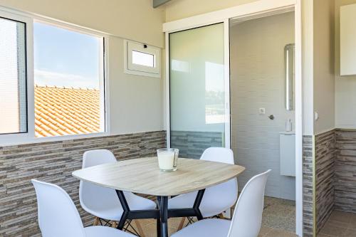 a dining room with a table and chairs at The Nature Nest by YOUR KEY MADEIRA in Santana
