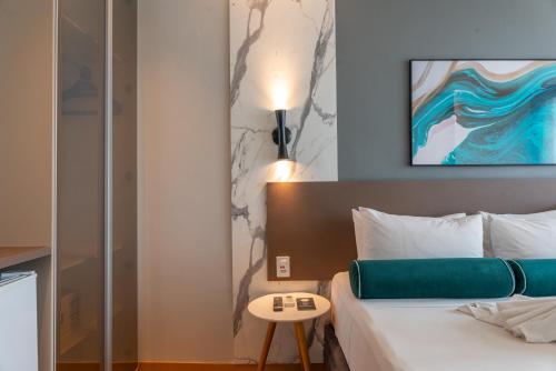 Ένα ή περισσότερα κρεβάτια σε δωμάτιο στο Hotel Água de Coco
