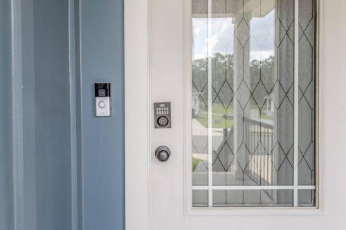 a white door with a window next to it at Spacious 4BR Home Near Midtown & FSU in Saint Peter