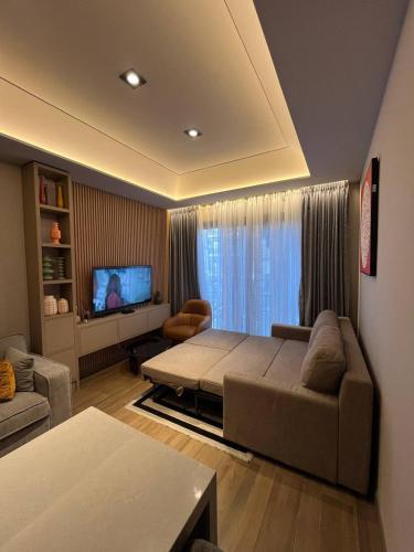 Ένα ή περισσότερα κρεβάτια σε δωμάτιο στο The Diamond In City Luxury Suites By ZENORA Living