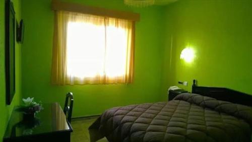 Cama o camas de una habitación en Hostal Villa María
