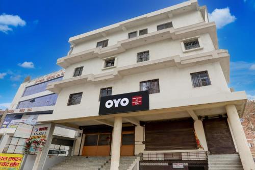 a building with an ovo sign in front of it at Hotel O Swarun and Banquet Hall in Gulzārbāgh