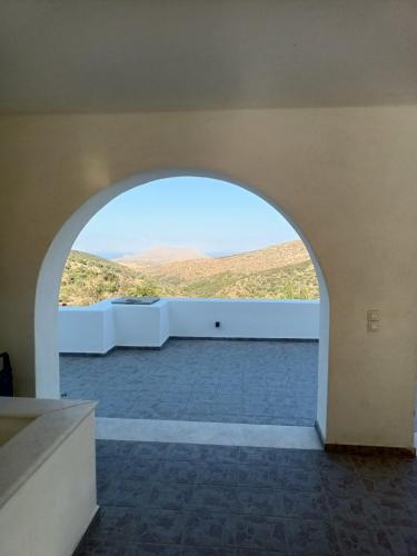 an archway in a room with a view at Lefkes Horizon in Lefkes