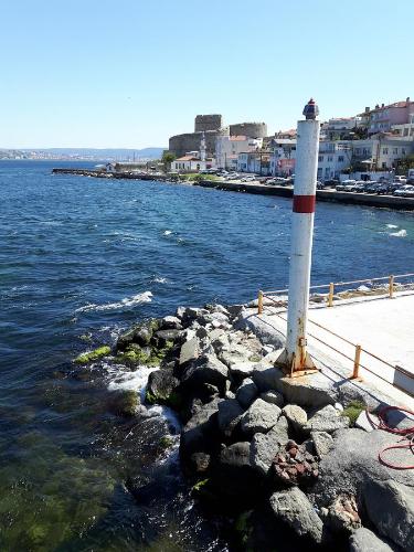 a lighthouse on the rocks next to the water at Dardanelles1915 in Canakkale