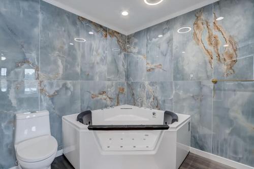 a bathroom with a sink and a toilet at Dells Lakefront Luxe Haven in Wisconsin Dells