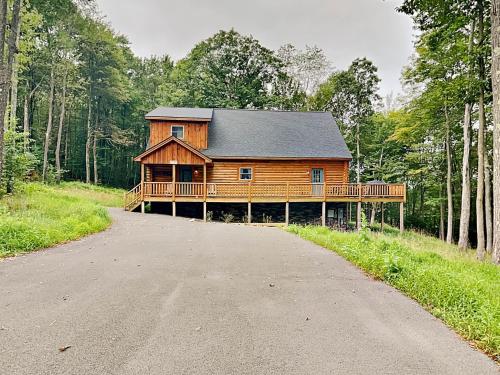 a large wooden house on the side of a road at Almost Eden in McHenry