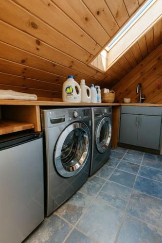 a washer and dryer in a kitchen with a ceiling at Drift Haus 4 and half BR Mountain Lodge in Windham