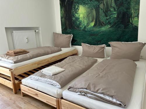 two beds sitting next to each other in a room at Fewo Uferglück in Seebruck