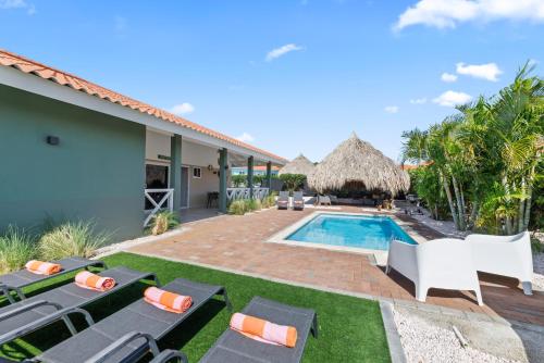 a villa with a swimming pool and a resort at Casa Juno in Fontein