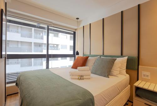 Apartamento novo em frente ao Allianz Parque com 1 vagaにあるベッド