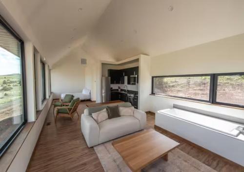 a living room with a couch and a table at Erik's Ranch in Livingston
