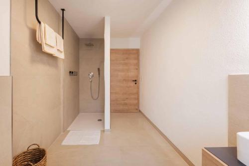 a bathroom with a shower in a room at Haus Bacher in Fulpmes