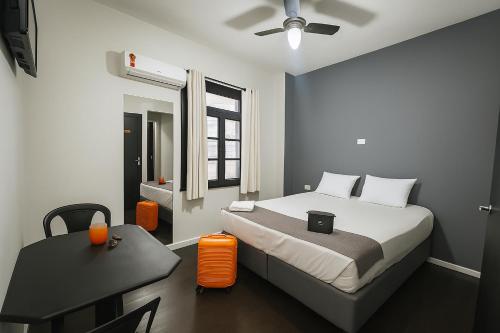 Ένα ή περισσότερα κρεβάτια σε δωμάτιο στο Hotel SP Centro