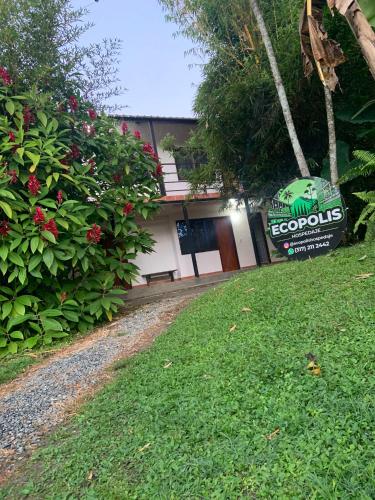 a building with a sign in front of a yard at balcones de 3 habitaciones en ecopolis el queremal in El Queremal