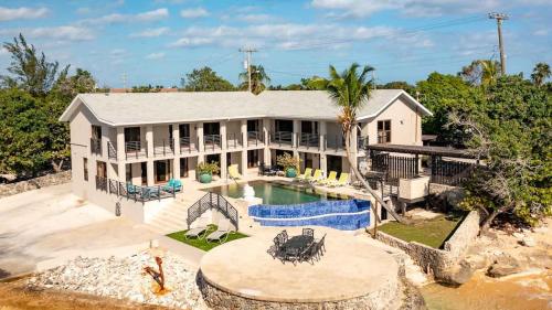 an aerial view of a house with a swimming pool at Seven Mile View Condo #1 in West Bay