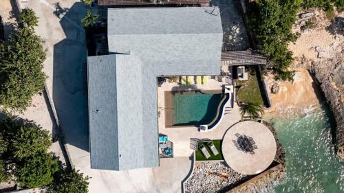 an overhead view of a house with a swimming pool at Seven Mile View Condo #1 in West Bay