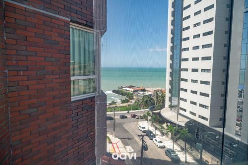 a view of the ocean from a building at Interatlântico by Qavi in Natal