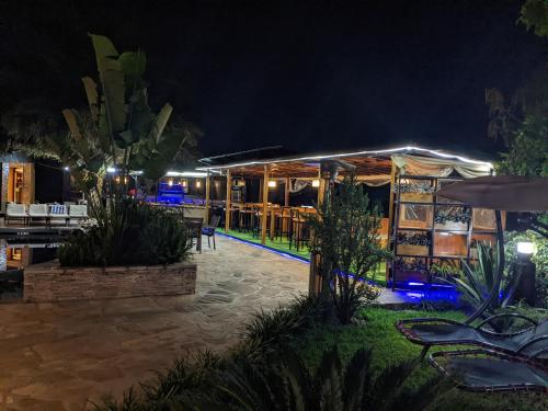 a night view of a restaurant with lights at Inside Afrika Boutique Hotel in Kigali