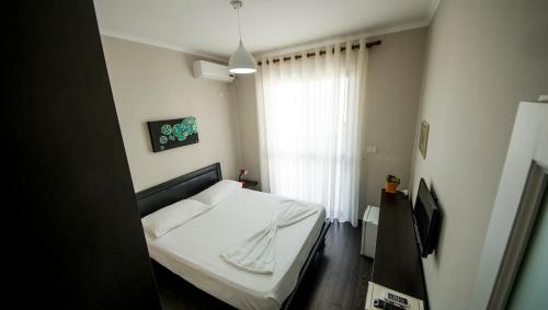 Postel nebo postele na pokoji v ubytování Kadrisa Hotel