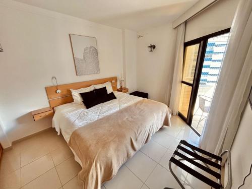 Ένα ή περισσότερα κρεβάτια σε δωμάτιο στο SHB - Apê Retrô Aconchegante Beira-Mar