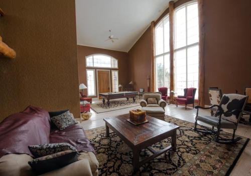 a living room with a couch and a table at Erik's Ranch in Livingston