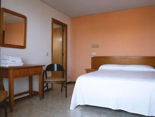 Ένα ή περισσότερα κρεβάτια σε δωμάτιο στο Vintage Hotel Mercedes