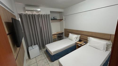 Postel nebo postele na pokoji v ubytování Havana Palace Hotel