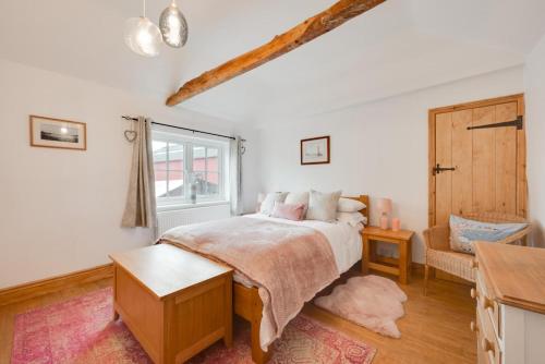 Ένα ή περισσότερα κρεβάτια σε δωμάτιο στο Lime Quay Cottage