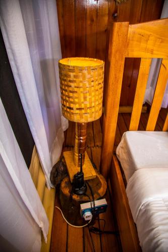 Postel nebo postele na pokoji v ubytování Kibo View Farm Lodge