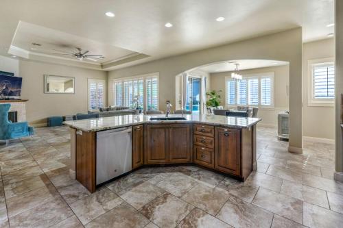 a large kitchen with a large island in a house at Havasu Duke Pool Spa Basketball Central in Lake Havasu City