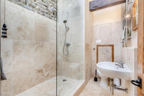 a bathroom with a sink and a shower at The Anchorage in Sheringham