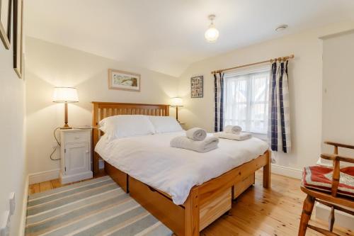 Postel nebo postele na pokoji v ubytování Wayfarer Cottage