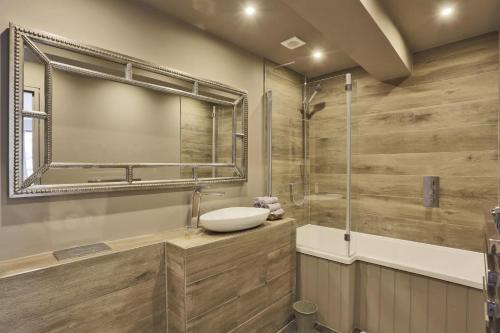 a bathroom with a sink and a shower at Stone Farm in Lavenham