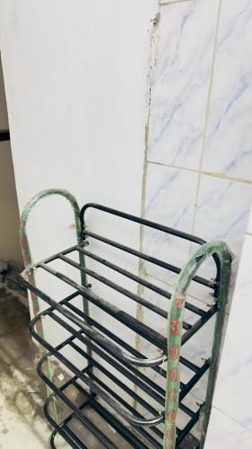 a metal bench chained to a wall at StayIn-SGH in Mysore