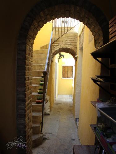 an alley with an archway in a building at Hotel Boutique Posada XVII in Puebla