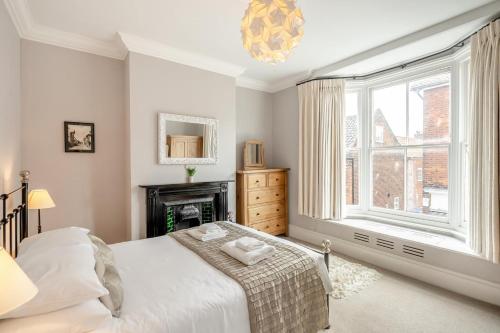 En eller flere senge i et værelse på Victoria Heights