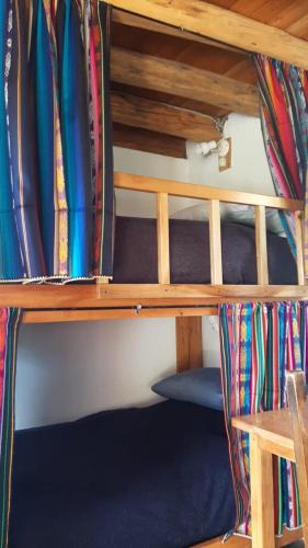a shelf in a room with a bunch of surfboards at The Black Sheep Inn in Chugchilán