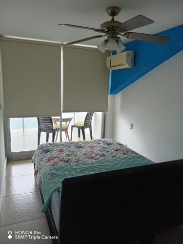 Una cama o camas en una habitación de PH El Palmar Residences 2203