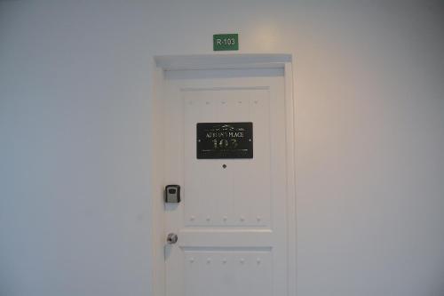 eine Tür mit einem Schild darüber in der Unterkunft Adrian's Place at La Bella Tagaytay in Galicias