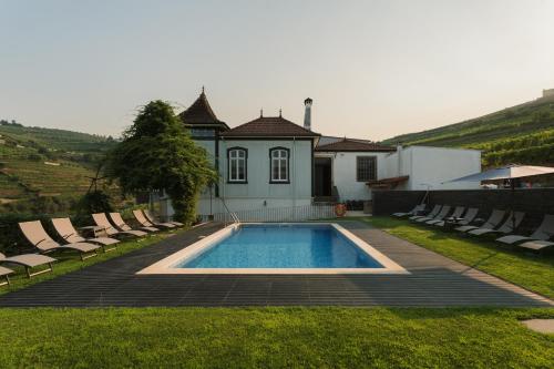 a house with a swimming pool in the yard at Casa de Cambres - by RowdHouses in Lamego