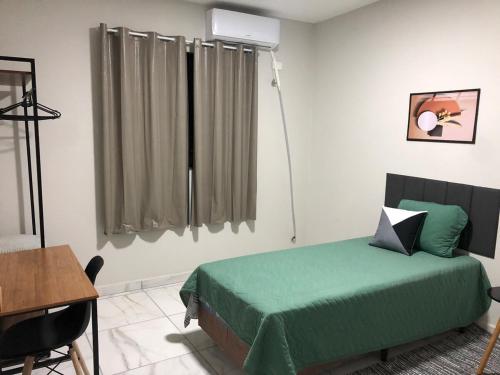 Ένα ή περισσότερα κρεβάτια σε δωμάτιο στο Ideal Suite em Brusque