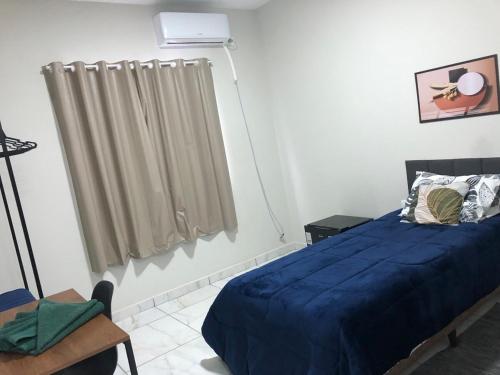 Ένα ή περισσότερα κρεβάτια σε δωμάτιο στο Ideal Suite em Brusque