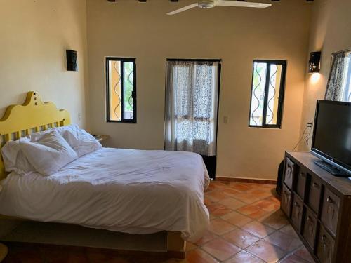 Ένα ή περισσότερα κρεβάτια σε δωμάτιο στο Casa Paraiso II