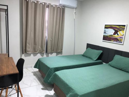 Katil atau katil-katil dalam bilik di Suite para 2 pessoas