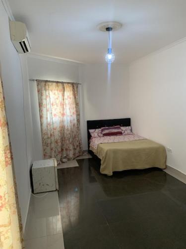 Ένα ή περισσότερα κρεβάτια σε δωμάτιο στο Casas lubango