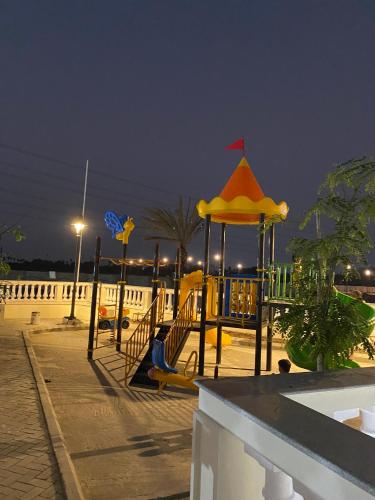 a playground with a gazebo at night at 2BHK Lakeview Apartment in chennai in Siruseri