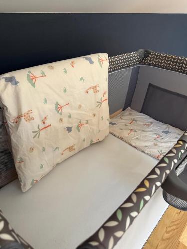 a bunk bed with a pillow on top of it at WieloDom - kryjówka na wsi in Wielogóra
